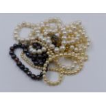 FIVE VARIOUS STRANDS OF PEARLS, THREE HAVING 9ct GOLD CLASPS AND TWO FASTENED WITH LARGE SILVER