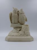 A VICTORIAN PARIANWARE OWL GROUP ENTITLED MATCH MAKING. 20cms. HIGH