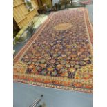 AN ANTIQUE COUNTRY HOUSE PERSIAN GALLERY CARPET. 654 x 275cms.