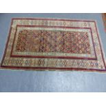 AN ANTIQUE CAUCASIAN KUBA RUG. 162 x 104cms.