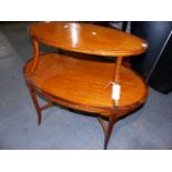 A SATINWOOD AND INLAID OVAL TWO TIER ETERGE. W.88cms.