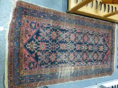 A GROUP OF FIVE ANTIQUE PERSIAN RUGS TO INCLUDE AFSHAR, HAMADAN AND BELOUCH EXAMPLES.