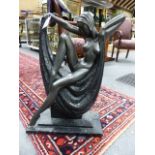 AN ART DECO STYLE FIGURAL GROUP OF A YOUNG LADY POSED ON A DRAPED PLINTH. H.60cms.