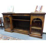 A WM.IV.ROSEWOOD INVERTED BREAKFRONT LOW BOOKCASE WITH GLAZED DOORS FLANKING OPEN SHELVES. W.185 x