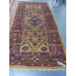 AN ANTIQUE PERSIAN SERAB RUG. 325 x 164cms.