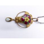 AN ENAMEL TUDOR ROSE GILDED OPENWORK PENDANT SUSPENDED ON A SILVER BAR LINK CHAIN. APPROXIMATE