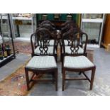 A SET OF SIX ANTIQUE GEO.III.STYLE MAHOGANY ARMCHAIRS WITH CURVED SEATS AND CARVED PIERCED BACKS.