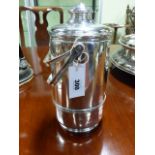 A CARTIER STERLING SILVER ICE BUCKET WITH DOUBLE HANDLES TOPPING THE CYLINDRICAL FORM VESSEL. THE