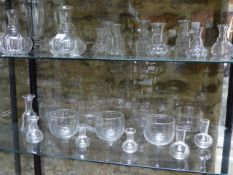 A COLLECTION OF ANTIQUE AND LATER GLASS TO INCLUDE FINGER BOWLS,VARIOUS DECANTERS AND CARAFES.