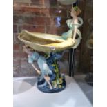 A CONTINENTAL ART NOUVEAU POTTERY PEDESTAL OYSTER SHAPED COMPORT SURMOUNTED BY TWO SEA NYMPHS. H.