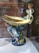 A CONTINENTAL ART NOUVEAU POTTERY PEDESTAL OYSTER SHAPED COMPORT SURMOUNTED BY TWO SEA NYMPHS. H.