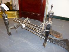 A PAIR OF GEORGIAN STYLE STEEL FIRE BASKET DOGS TOGETHER WITH TWO PAIRS OF FIRE TOOLS OF SIMILAR