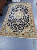 A PERSIAN SAROUK RUG. 220 x 138cms.