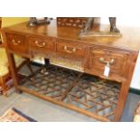 WITHDRAWN FROM SALE.....AN ORIENTAL HARDWOOD SIDE TABLE WITH FOUR DRAWERS, PIERCED FRIEZE AND
