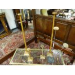 A GROUP OF FOUR ART DECO OAK WIG OR HAT DISPLAY STANDS AND A LATER METAL THREE BRANCH EXAMPLE.