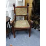 AN UNUSUAL ANTIQUE CARVED MAHOGANY ARMCHAIR WITH STYLISED FISH FORM ARMS.