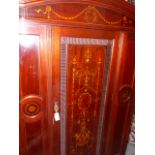 A GOOD QUALITY EARLY 20th.C.MAHOGANY AND INLAID SINGLE DOOR WARDROBE WITH SPLAY CORNICE AND BASE