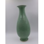 A CHINESE CELADON TAPERED BALUSTER FORM VASE WITH INCISED FLORAL DECORATION AND SEAL MARK TO BASE.