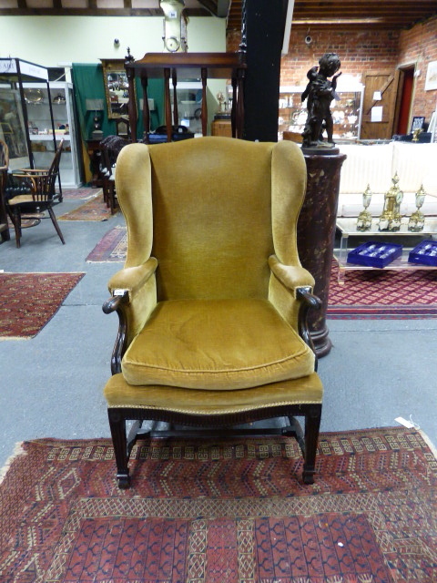 A GOOD QUALITY EARLY 20th.C. GEORGIAN STYLE WING BACK ARMCHAIR. W.69 x H. 110cms.