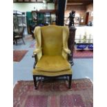 A GOOD QUALITY EARLY 20th.C. GEORGIAN STYLE WING BACK ARMCHAIR. W.69 x H. 110cms.