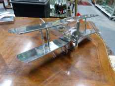 A GOOD ART DECO STYLE ALLOY MODEL OF A BI-PLANE. L.34cms.