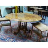 A VICTORIAN BURR WALNUT AND INLAID BREAKFAST TABLE ON QUADRUPED SUPPORTS. W.119cms.