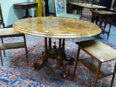 A VICTORIAN BURR WALNUT AND INLAID BREAKFAST TABLE ON QUADRUPED SUPPORTS. W.119cms.