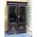 A COLONIAL MOORISH STYLE HARDWOOD AND INLAID GLAZED DISPLAY VITRINE CABINET. W.112 x H.175cms.