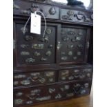 AN ANTIQUE JAPANESE TABLE CABINET VARIOUSLY DECORATED WITH BRONZE MINUKI TYPE MOUNTS