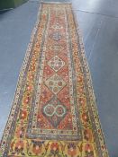 AN ANTIQUE PERSIAN HAMADAN RUNNER.