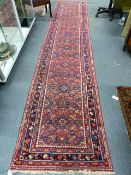 A PERSIAN HAMADAN RUNNER. 416 x 84cms.