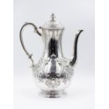 A VICTORIAN EMBOSSED SILVER HALLMARKED COFFEE POT, DATED 1859 SHEFFIELD, APPROXIMATE HEIGHT 27cms,