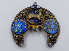 AN ARTS AND CRAFT WHITE METAL AND ENAMELLED BROOCH. ORIGINALLY A HAIRSLIDE, THE CENTRE PANEL WITH