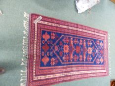 A TURKISH TRIBAL RUG 204 x 113cms. TOGETHER WITH AN ORIENTAL RUG OF BOKHARA DESIGN.