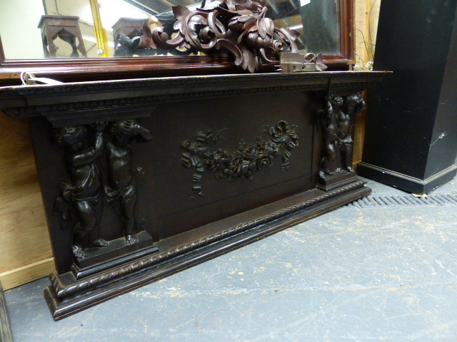 A 19th.C.CARVED OAK PANEL POSSIBLY AN OVERMANTLE WITH FLORAL SWAG FLANKED BY CHERUBS. W.145cms.