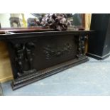 A 19th.C.CARVED OAK PANEL POSSIBLY AN OVERMANTLE WITH FLORAL SWAG FLANKED BY CHERUBS. W.145cms.