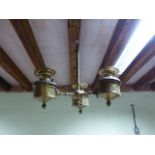 A VINTAGE BRASS THREE FONT HANGING LIGHT WITH PIERCED GOTHIC REVIVAL DECORATION. H.66cms.