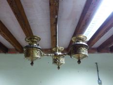 A VINTAGE BRASS THREE FONT HANGING LIGHT WITH PIERCED GOTHIC REVIVAL DECORATION. H.66cms.