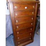 A LATE VICTORIAN OAK WELLINGTON CHEST OF SEVEN DRAWERS WITH SIDE LOCKING BARS 52 X 112 CM