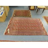 TWO ANTIQUE TEKKE BOKHARA RUGS. 175 x 11cms AND 121 x 105cms.