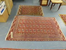 TWO ANTIQUE TEKKE BOKHARA RUGS. 175 x 11cms AND 121 x 105cms.