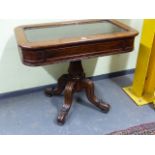 AN EARLY VICTORIAN MAHOGANY BIJOUTERIE TABLE WITH GLAZED RISING TOP OVER REEDED COLUMN ON