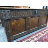 AN 18th.C.OAK AND INLAID PANEL FRONT COFFER. W140 x D54 x H.61cms.
