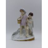 A PORCELAIN FIGURE GROUP THE BATHERS SIGNED A BERGES 22cms. HIGH.