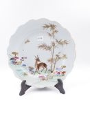 A CHINESE EXPORT FAMILLE ROSE PLATE DECORATED WITH A DEER. D.24cms.