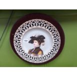 AN ANTIQUE CONTINENTAL PIERCED BORDER CABINET PLATE DECORATED WITH A PORTRAIT BUST OF A YOUNG LADY