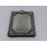 A HALLMARKED SILVER REPOUSSE FRONTED MIRROR DATED 1901 BIRMINGHAM. APPROXIMATE MEASUREMENTS