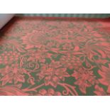 A ROLL OF MORRIS & Co DESIGN WALLPAPER OF FLORAL DESIGN ON A RED GROUND, AS NEW.