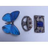 A LARGE SILVER STAMPED BUTTERFLY WING BROOCH SET WITH OPALS, TOGETHER WITH TWO FURTHER WHITE METAL