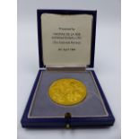 A PRECIOUS YELLOW METAL CASED COMMEMORATIVE COIN "THE NIGERIAN SECURITY PRINTING AND MINING